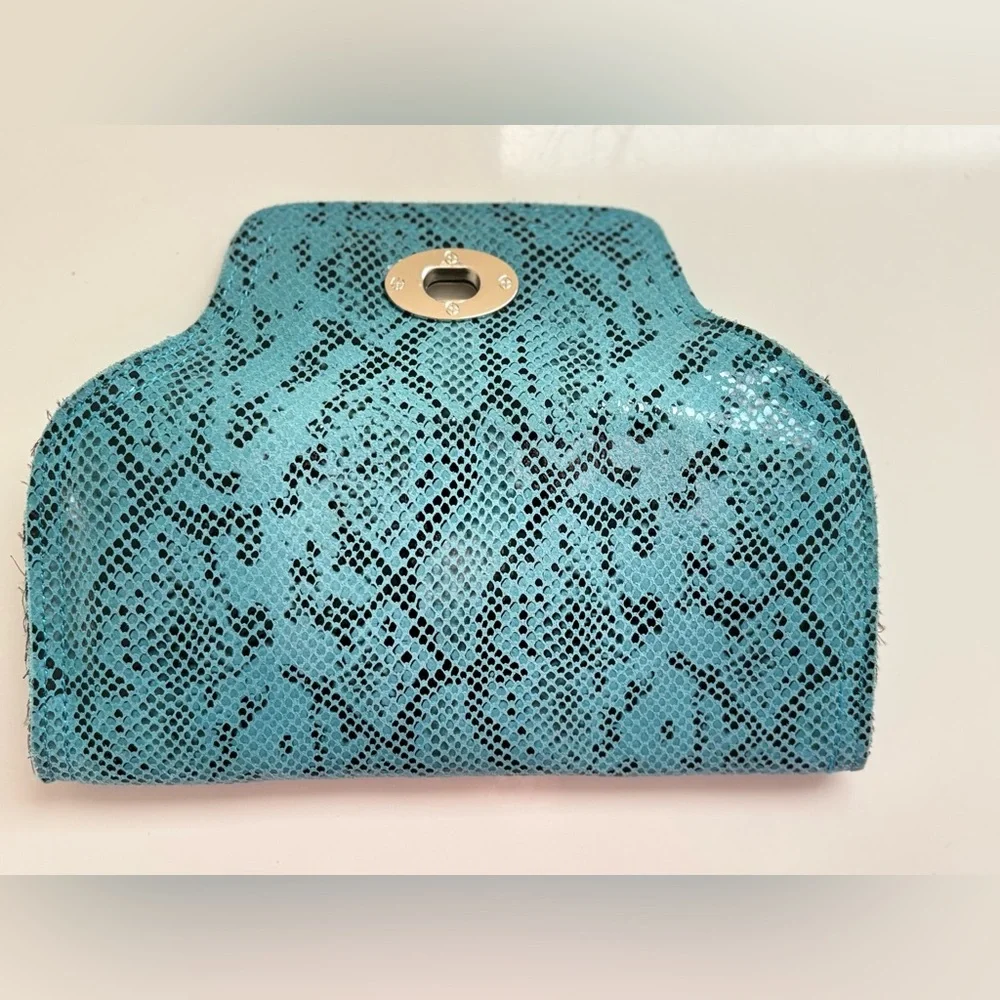 Turquoise python or snakeskin patterned leather clutch bag a twist-lock closure